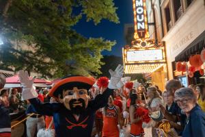 View of UVA mascot Cavman and cheerleaders on the Charlottesville Downtown Mall