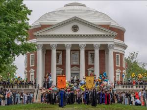 Students and faculty walking the Lawn at Final Exercises with the Rotunda in the background