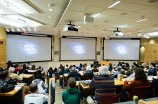View of screens in Rice Hall 130 at the start of the film screening