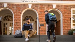 Two students on the steps outside Thornton Hall
