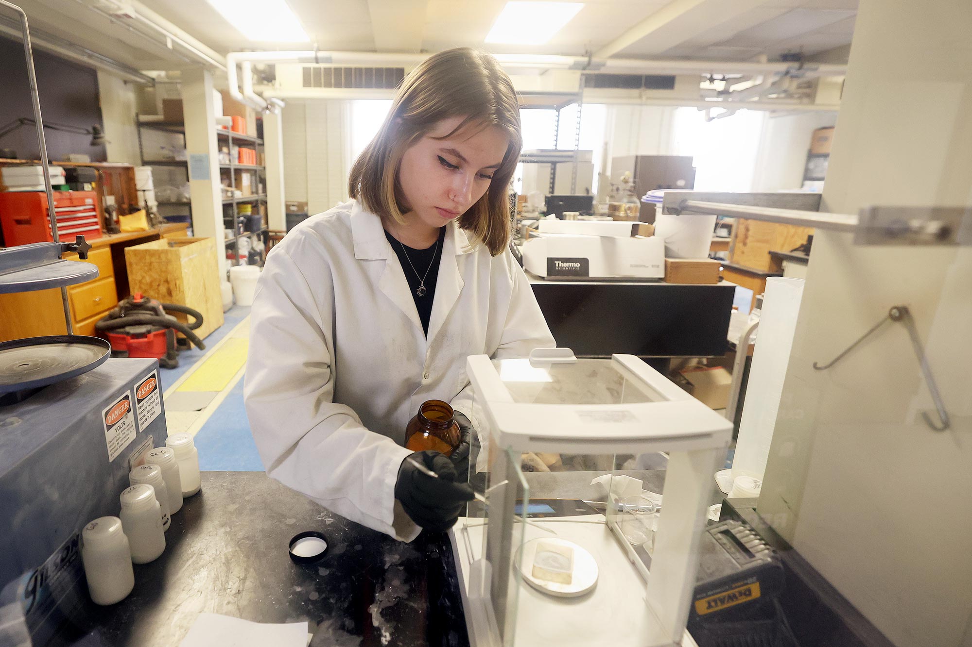 Female undergraduate student working in a lab