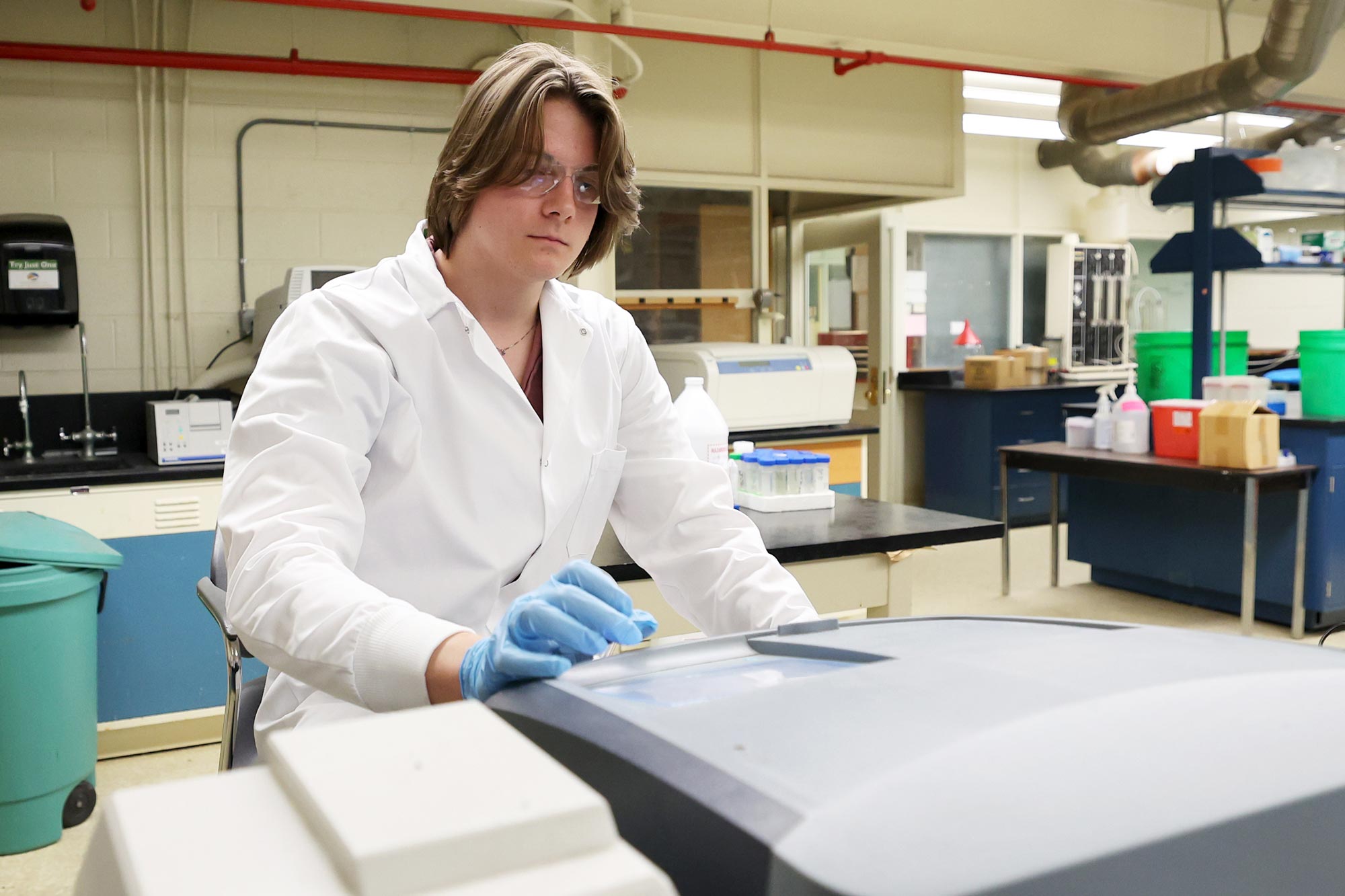 Male undergraduate student working in a lab