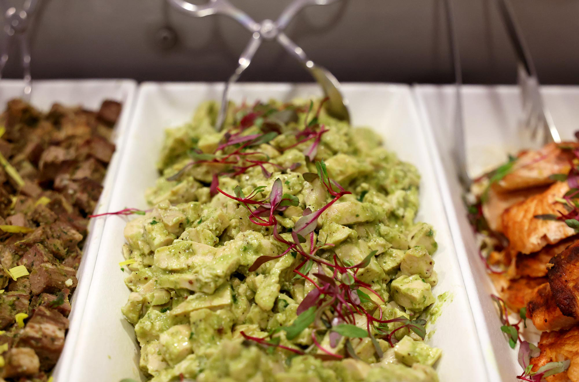 Closeup of salads in a food line