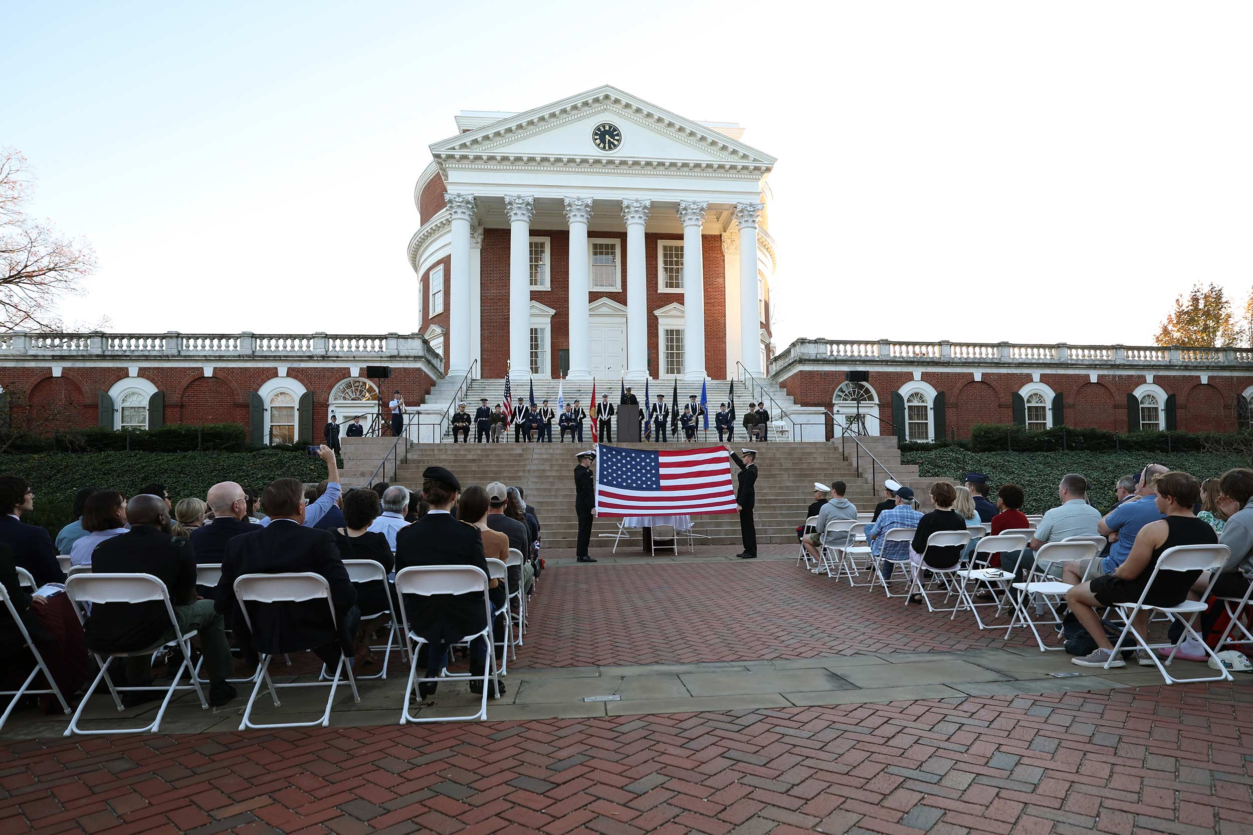 Cadets, midshipmen and guests, including University President Jim Ryan, attend a Veterans Day ceremony on the north plaza of the Rotunda Friday afternoon. (Photo by Matt Riley, University Communications)