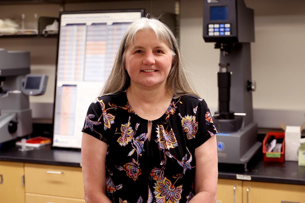 A U.S. Navy veteran, Natasha Smith poses in her classroom  A U.S. Navy veteran, Smith draws on practical experience gained serving in the Seabees while pursuing her academic career.