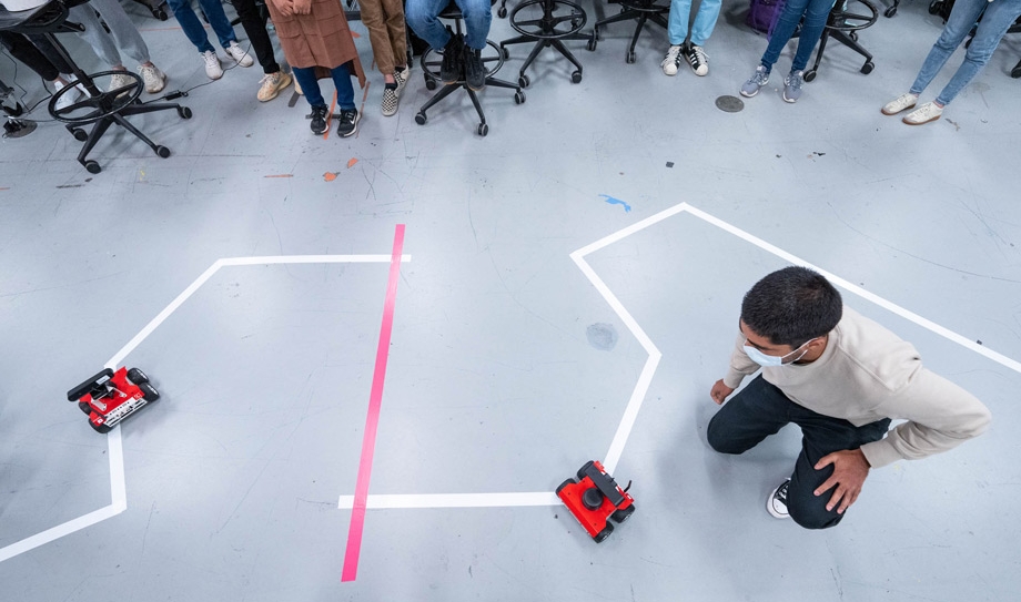 students navigating a course with robotic cars