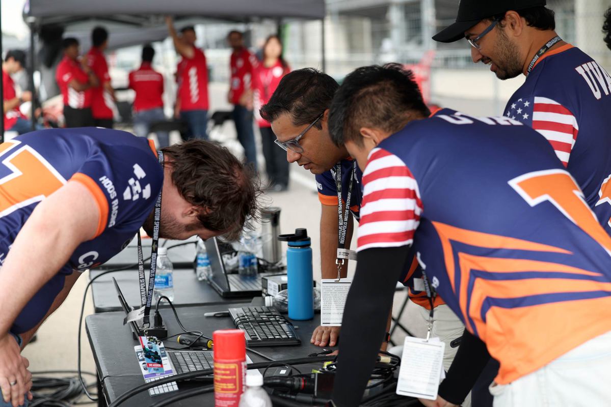 Weiss, Behl, Ning and Ammar Kulkarni huddle in the pit. (Photo by Matt Riley, University Communications)