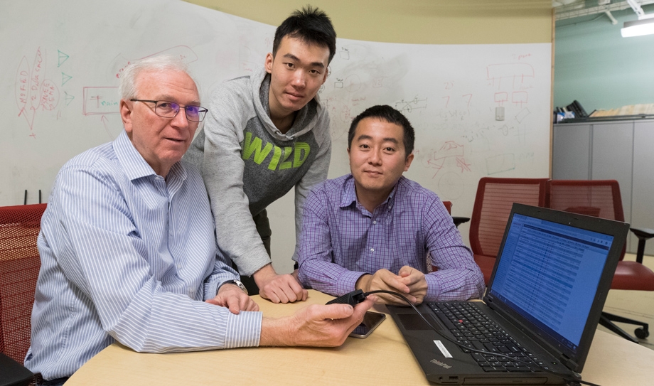 Professor of computer science Jack Stankovic (from left), student Nan Wang and associate professor Hongning Wang are developing a system to help caregivers of dementia patients. (Photo by Dan Addison, University Communications)