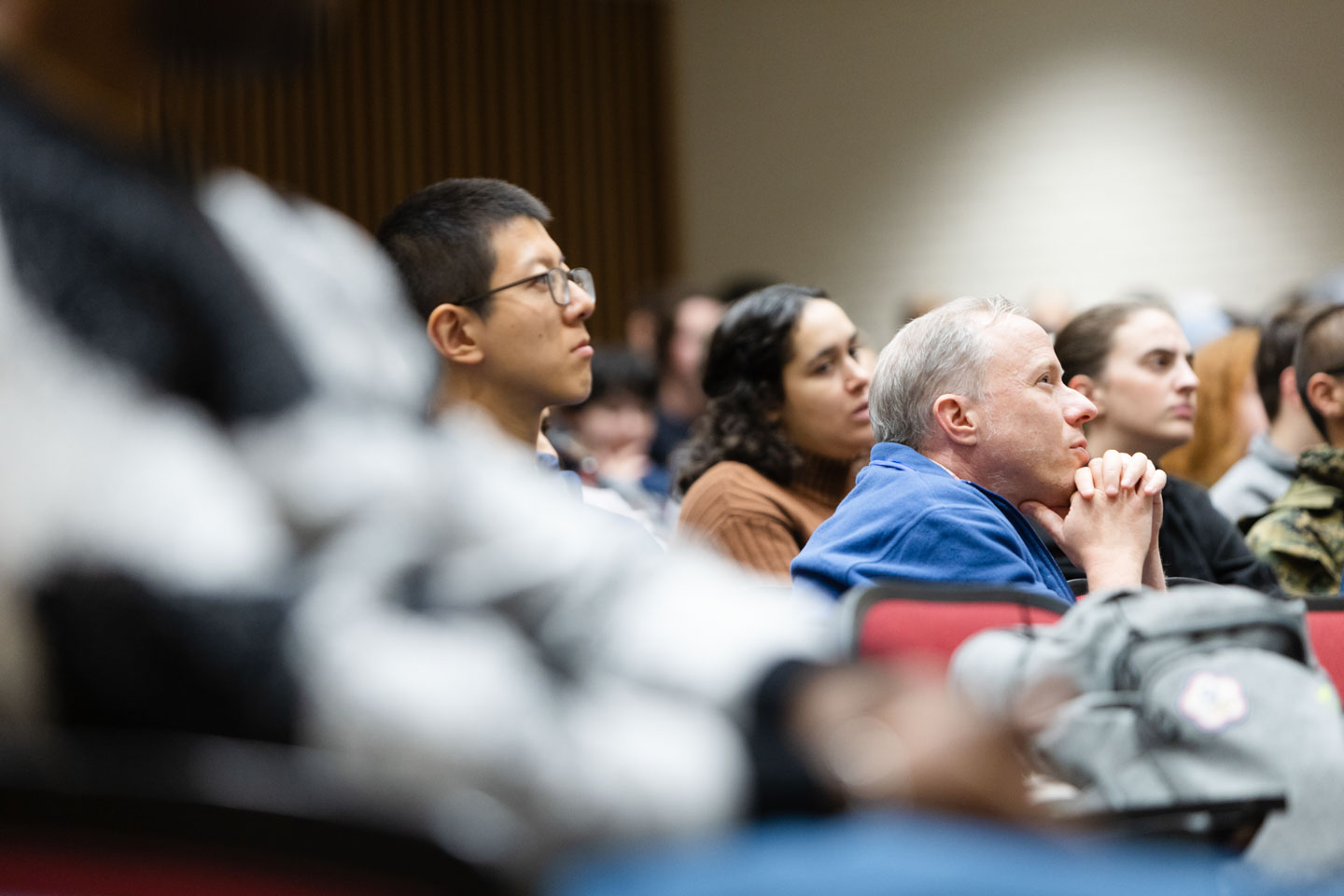 Students and professors look on during the inaugural talk.