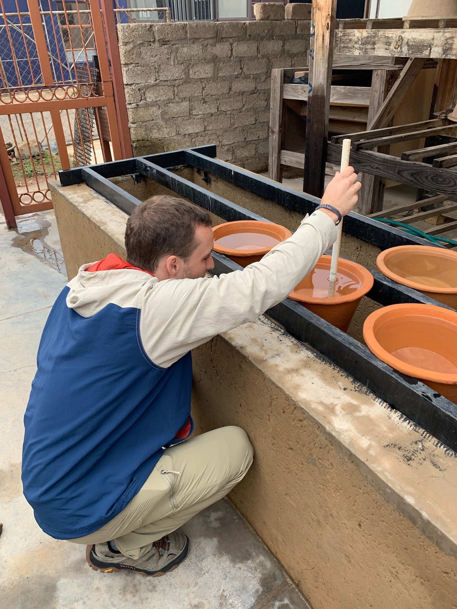 Hertel conducts point-of-use water treatment in Hammanskraal, South Africa, through professor James A. Smith’s water quality lab.
