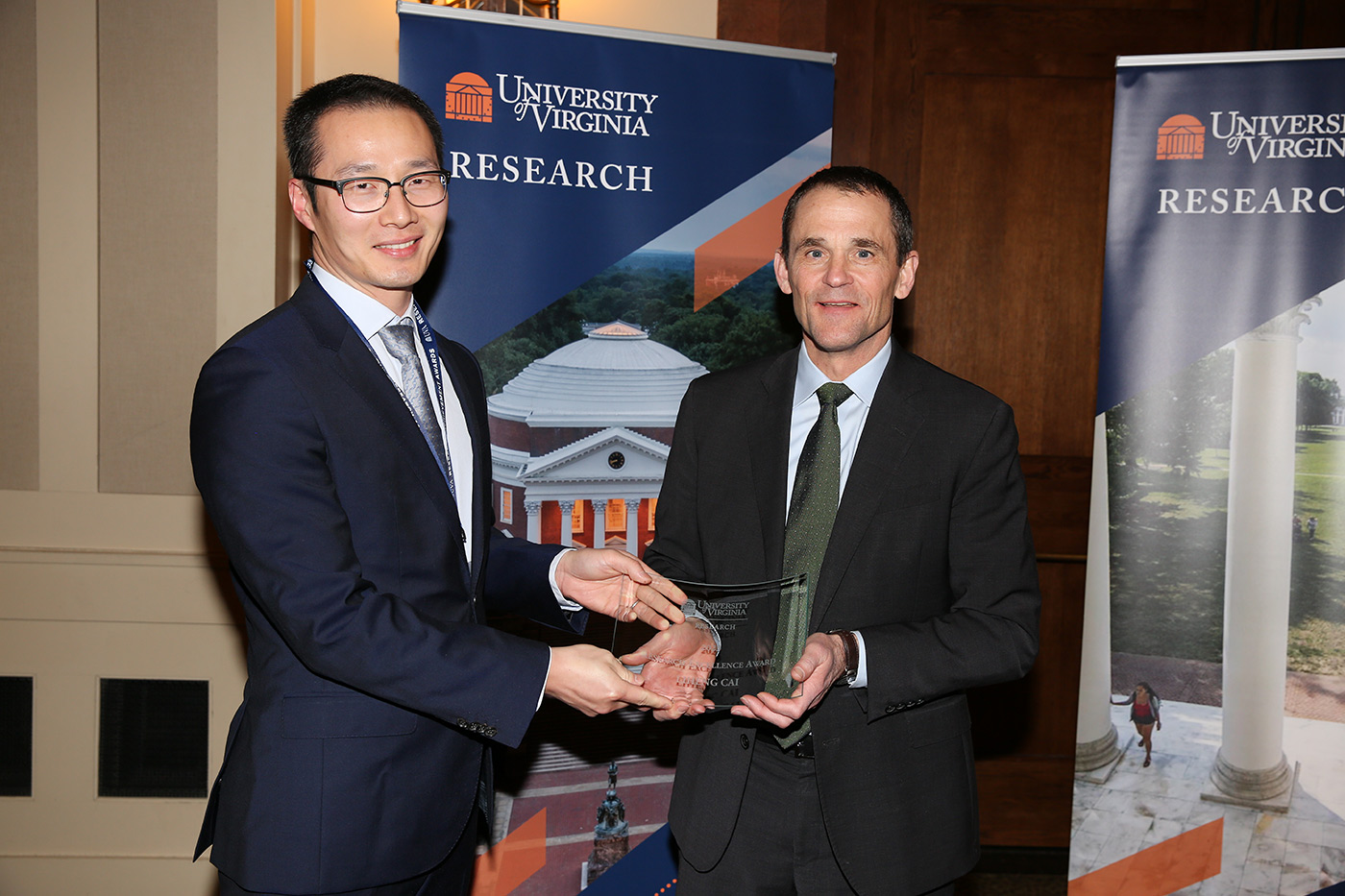 From left to right: Assistant professor Liheng Cai and President Jim Ryan.