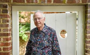 Gregory Olsen standing in the garden area near his temporary living quarters on the Lawn, the Mews.