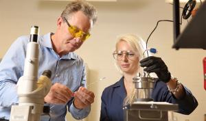 John Scully with post doc Elena Romanovskaia in the lab