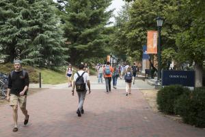 Students walking down Engineer's Way at UVA
