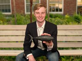 Carl White displays Tunabot Flex, one of the bio-inspired fish robots that are key for developing advanced autonomous underwater vehicles.