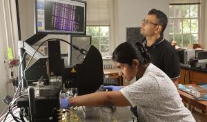 Nikhil Shukla with a student in the lab