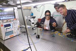 Prof. Steven Bowers and students use a piece of lab equipment