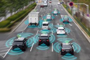 Photo illustration of autonomous connected vehicles on the road