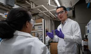 Materials science and engineering assistant professor Liheng Cai talks with a graduate student in his soft biomaterials lab.