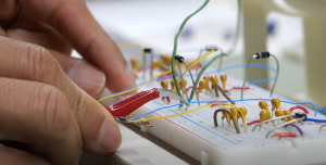 Student working on a circuit board