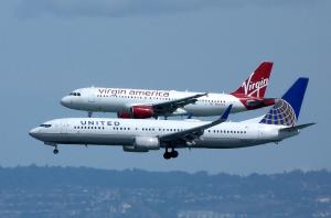 two airliners fly side-by-side