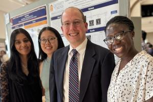 Dr. Timohty Allen with 3 Capstone Students from the Class of 2024.