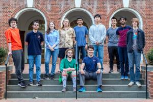 Cyber defense students gather on steps at Thornton Hall.