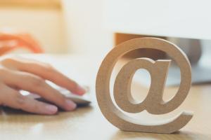 background image: email icon and a hand working mouse