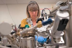 Cathy Dukes working on the Scanning X-ray Photoelectron Spectrometer