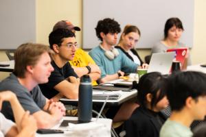 Students watch a capstone presentation