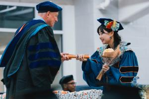 Graduate receives her diploma