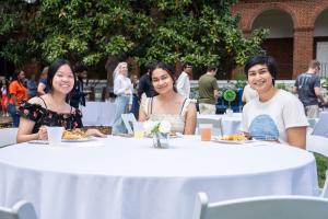 Students at a table during a picnic