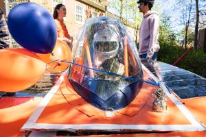Solar car team member in car