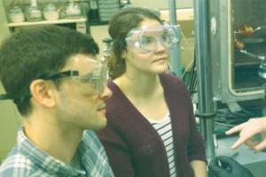 Burns Group students talk in the lab