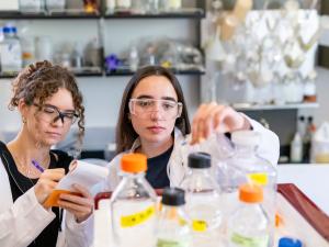 Two students examine samples in a chemical engineering lab