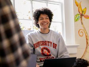 Smiling student in a UVA sweatshirt