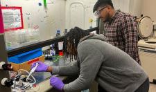 High school student working with CHE grad student mentor in chemical engineering lab