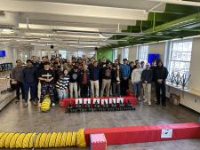 Prof. Madhur Behl and his autonomous vehicle design class in the Link Lab arena