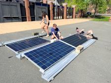 students working on solar panels