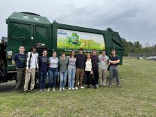 students at recycling plant