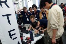 A group of people working on a computer