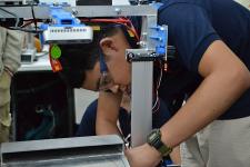 A person working on a machine