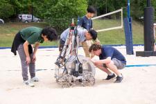 A group of people working on a robot