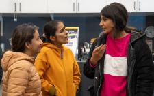 Three students talking