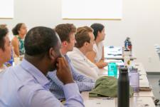 Students watch a final presentation