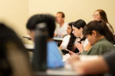 Students in the audience during a presentation