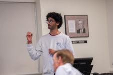 A student speaks during a capstone presentation