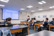 A student speaks during a capstone presentation