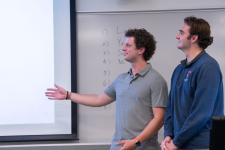 Students speak during a capstone presentation