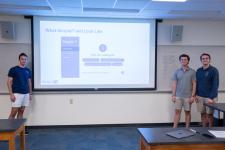 A student group concludes their capstone presentation